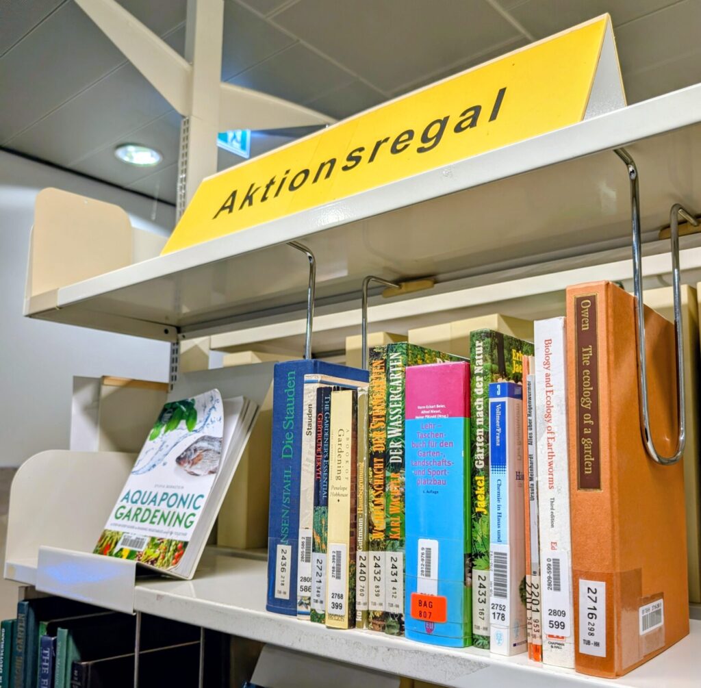 Shelf with books about gardens.