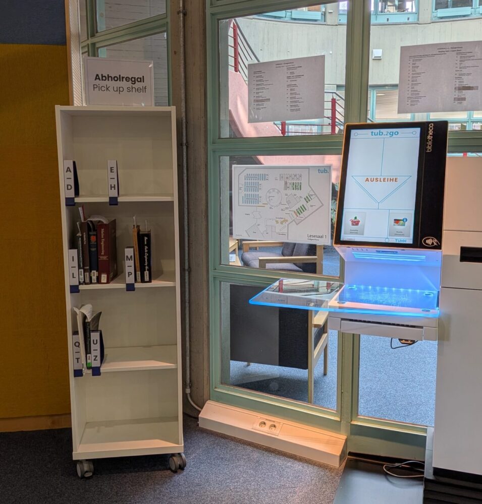 Pick-up shelf beside the selfe-check-out station in front of the rotunda